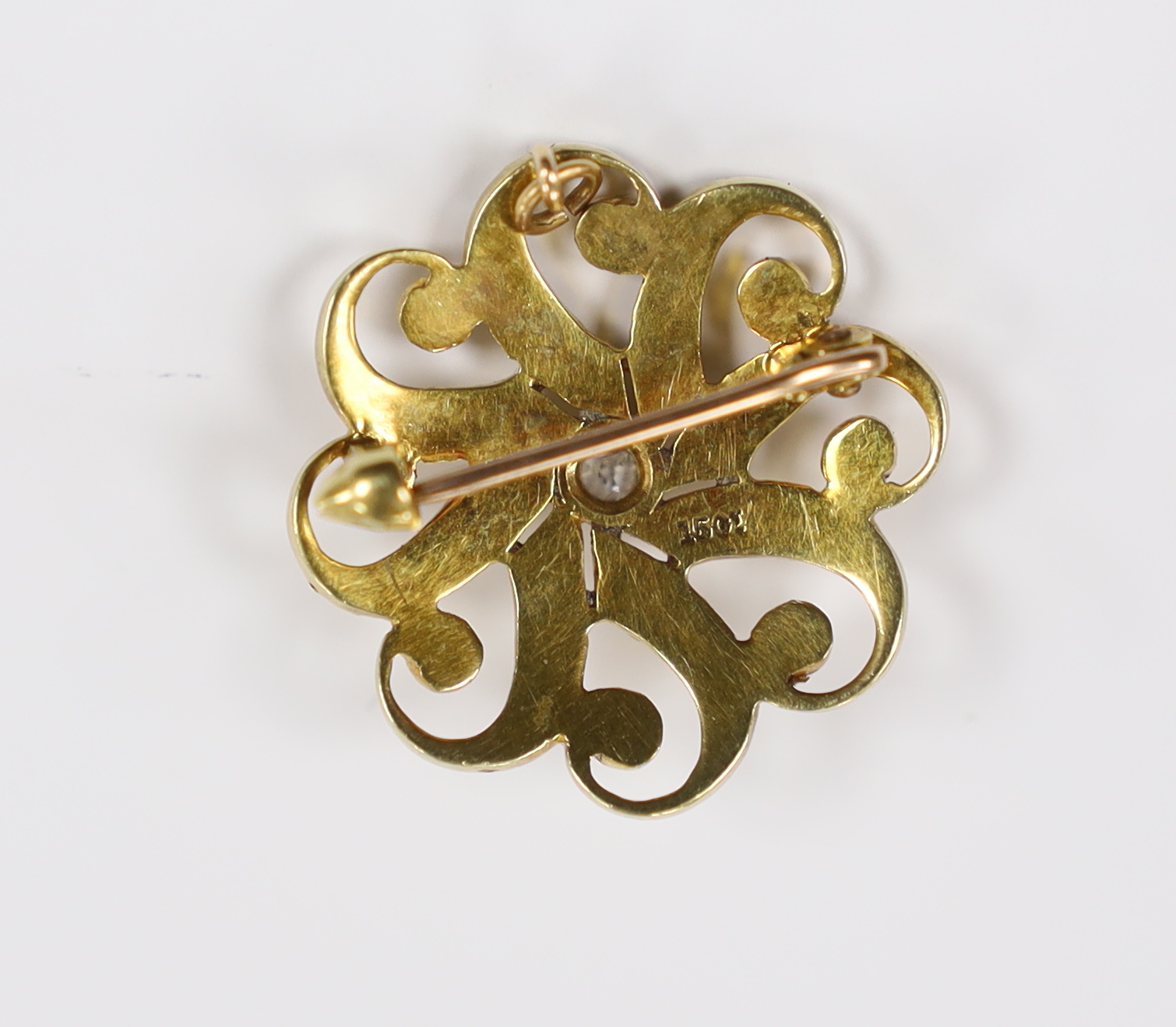 An Edwardian 15ct, seed pearl cluster and single stone diamond set circular brooch, 23mm, gross weight 4.8 grams.